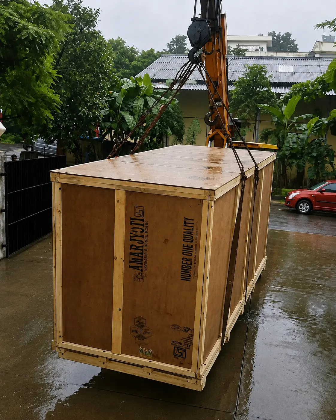 Large wooden packing case being lifted safely by a crane